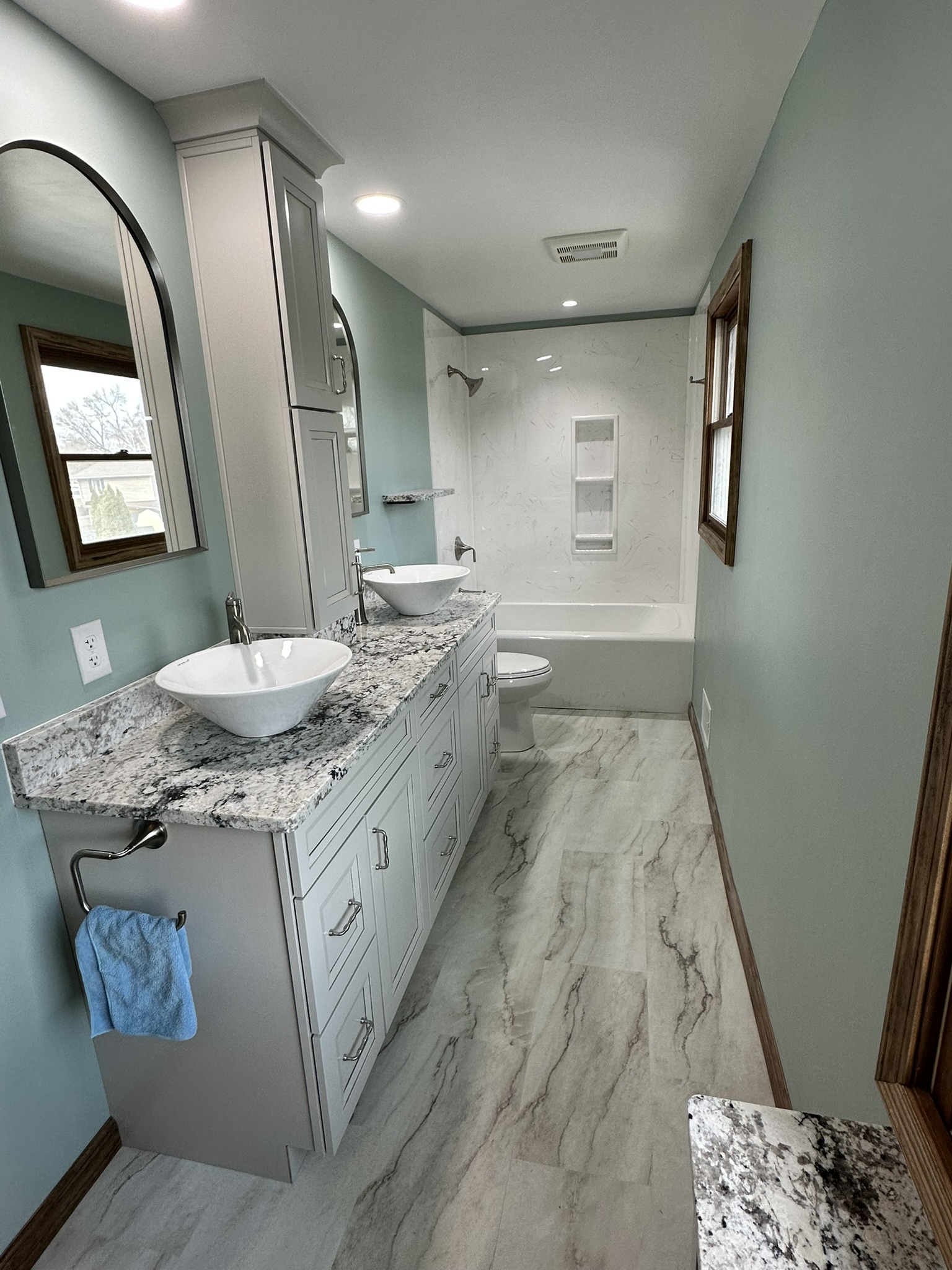 Kitchen with green cabinets and granite countertops
